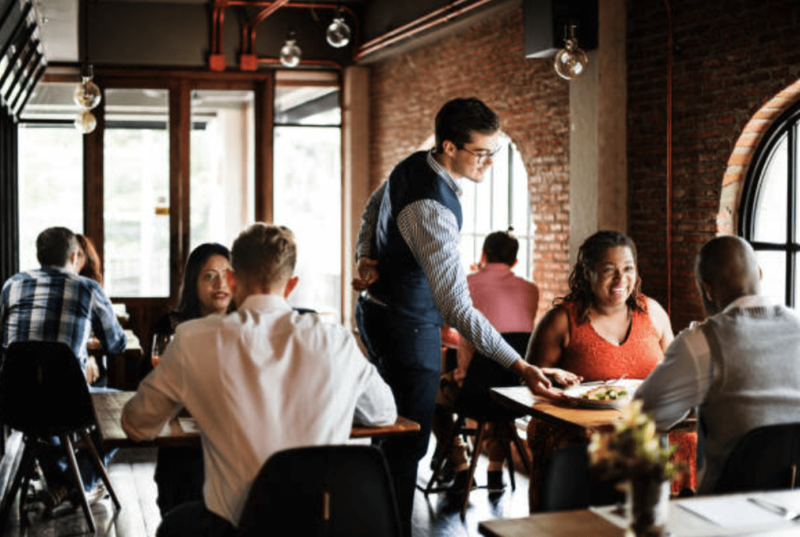 a lively coffee shop filled with people in conversation