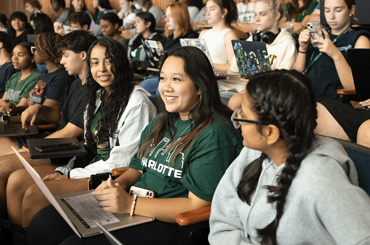 a group of new students smile at each other during new student orientation